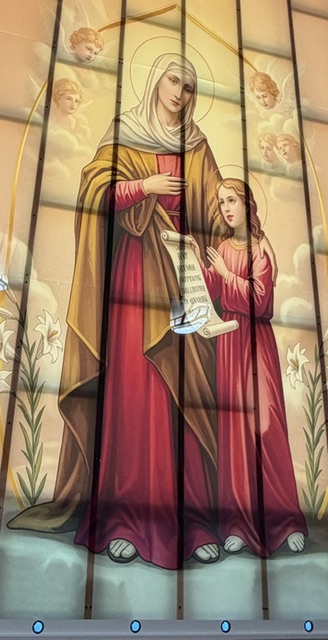 A mosaic of Saint Anne teaching the young Virgin Mary to read scripture.